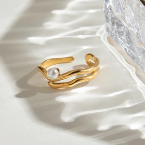 18K gold plated stainless steel wave ring featuring a white pearl on a water ripple background