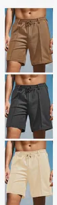 Macro detail of casual men's shorts showing textured pineapple grid fabric and drawstring