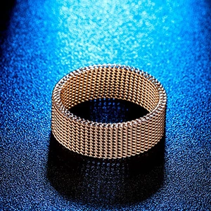 Detail view showing intricate rose gold mesh woven texture on the titanium steel band