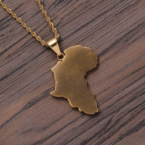 Hiphop gold African map pendant necklace with twist chain on dark wood background