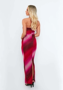 Detail of slim-fit tube dress featuring gradient red-purple print and back slit design
