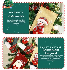 Detail of burlap Christmas stocking featuring a snowman and santa with a hanging loop