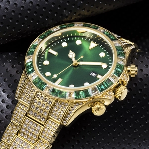 Macro detail of luxury gold watch featuring a green sunray dial and crystal-encrusted bezel