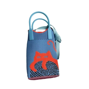 Detailed blue knitted phone bag featuring red cat pattern and black yarn ball design