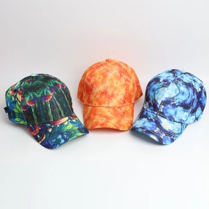 Detailed view of tie-dye baseball caps in green mushroom, orange flame, and blue marble patterns