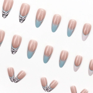 Long almond French press-on nails with light blue tips and zebra animal pattern