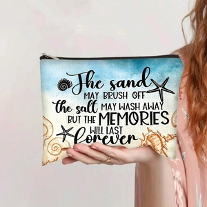 Close-up of canvas pouch with starfish prints held in hand showing material size