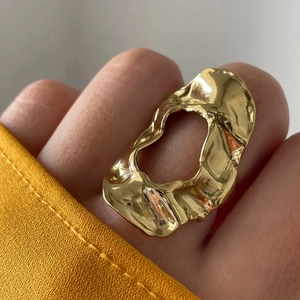 Exaggerated 18k gold plated stainless steel irregular open ring with a lava-like molten texture