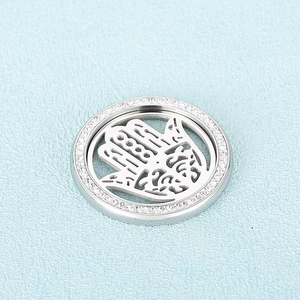 Silver stainless steel round Hamsa Hand pendant with sparkling zircon border