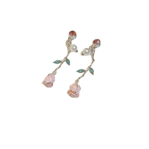 Elegant floral tassel earrings featuring pink rose resin buds and small white pearls on white background