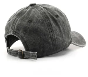 Detail of vintage washed baseball cap with adjustable metal buckle and cotton texture