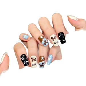 Cute Japanese style press-on nails with puppy plaid pattern and star art on long coffin nails