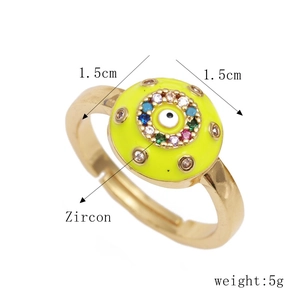 Detail of adjustable gold ring with 1.5cm yellow eye motif and colorful zircons