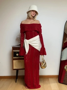 Elegant red off-shoulder knit maxi dress with long flare sleeves and white accessories