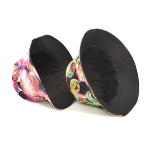 Dual-sided bucket hat with vibrant tie-dye print and solid black lining for sun protection