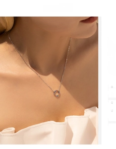 Macro view of S925 silver necklace with rainbow pavé zircon pendant on model
