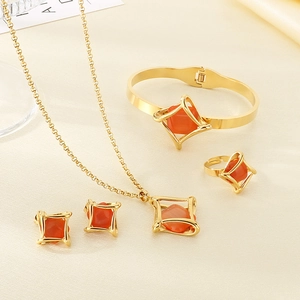 Luxurious gold stainless steel jewelry set with geometric orange stone inlay