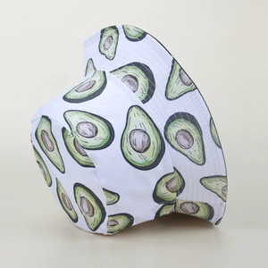 Close-up of fresh green avocado pattern on a white cotton bucket hat with clean texture