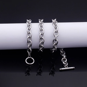 Close-up of silver stainless steel cable chain with decorative OT toggle clasp detail