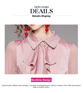 Detail of pink satin shirt featuring ruffled lapel collar and pearl diamond button