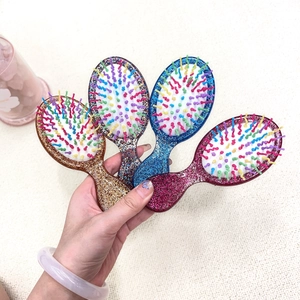 Portable mini glitter air cushion hairbrushes for girls in four shiny colorful finishes
