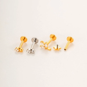 Titanium flat back stud set featuring gold and silver cactus, leaf, and star designs with gems