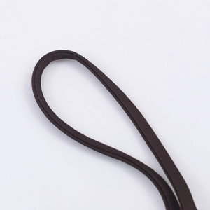 Macro detail of high-quality dark brown woven strap with durable stitching for bags