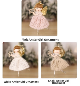 Close-up of lace skirts and glittery wings on reindeer girl Christmas hanging ornaments
