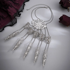 Gothic silver hollow finger bracelet with pointed nail rings and chain on silk