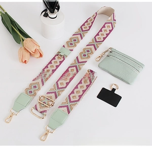 Close-up of bohemian woven shoulder strap with green coin purse and gold hardware