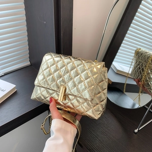 Quilted gold crossbody bag with metallic finish and chain strap for women