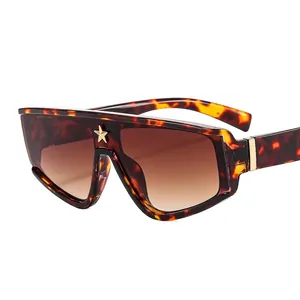 Fashionable oversized tortoise sunglasses with gold star accent and brown gradient lenses