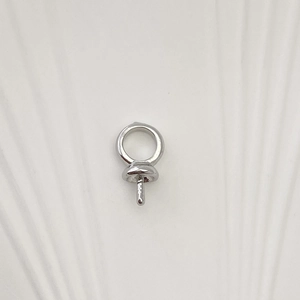 Macro view of silver color 18K gold plated threaded screw eye pin jewelry accessory