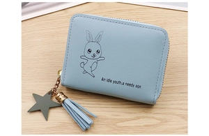 Close-up of light blue PU leather wallet with cartoon rabbit and star tassel charm