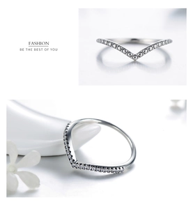 Detail view of S925 silver V-shaped rings featuring micro-set pavé stones and beaded edges