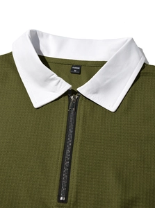 Detail of olive green waffle knit shirt showing white polo collar and silver zipper