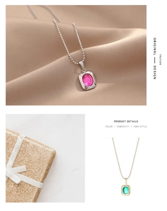 Macro detail of rectangle crystal pendant on bead chain with gold and silver finish