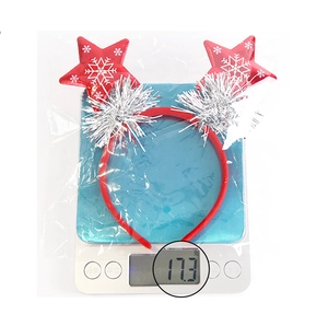 Detailed view of a red star Christmas headband with snowflake patterns weighing 17.3 grams