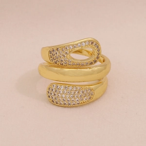 Macro shot of gold multi-layer wrap ring with cubic zirconia teardrop accents