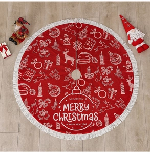 Detailed top view of a red Christmas tree skirt with reindeer motifs and white tassels