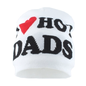 Detail of white knit beanie featuring bold black letters and a red heart graphic pattern