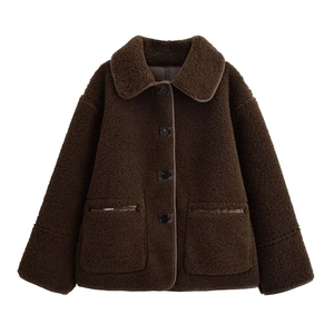 Fashionable dark brown reversible shearling jacket with large pockets and classic lapels