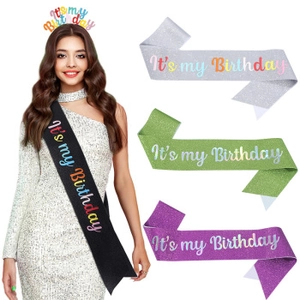Detail showing glittery HAPPY BIRTHDAY sash and crown set in black, silver, green, and purple