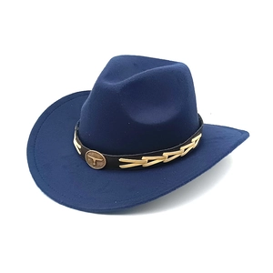 Detail of dark blue felt cowboy hat featuring golden bull head emblem and leather band