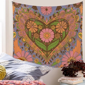 Detail of bohemian floral heart tapestry with vibrant colors in cozy bedroom setting