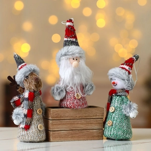 Christmas plush dolls set with Santa Claus, Reindeer and Snowman on festive background