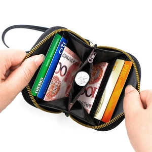 Short black faux leather cat wallet for women featuring multiple card slots and gold zipper