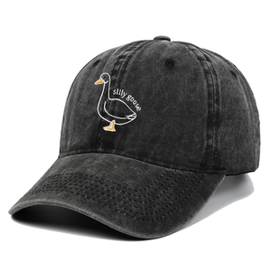 Close-up of silly goose embroidery on washed grey denim baseball cap for outdoor wear