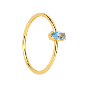 Detailed macro view of an 18k gold ring featuring a marquise-cut blue zircon stone