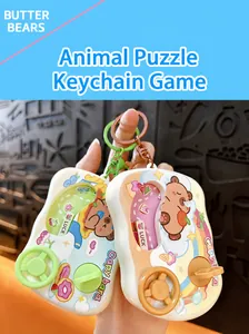 Close-up of car-shaped handheld water game keychain with cute animal designs.
